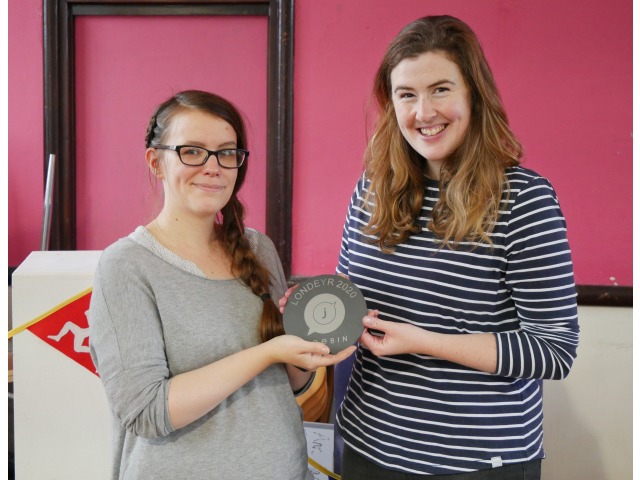 Vicky Webb receiving the award from Ruth Keggin Gell, the Manx Language Development Officer at Culture Vannin, one of the partners of Jeebin, the Manx Language Network